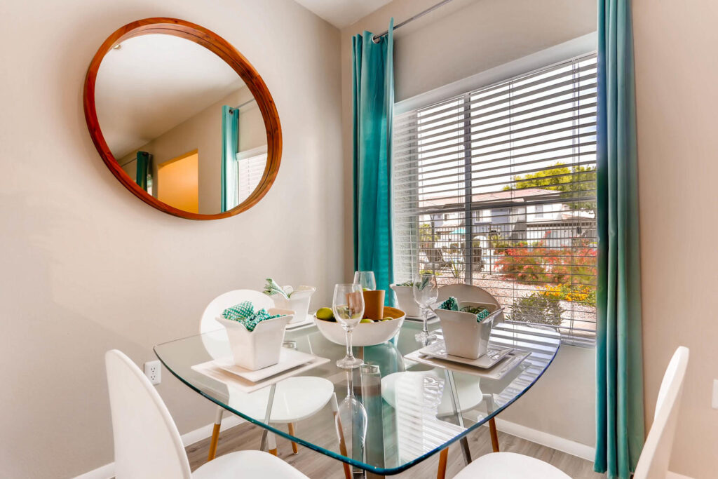 Dining area with large window at Verano Townhomes in Phoenix.